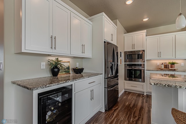 kitchen featuring wine cooler, white cabinetry, dark wood-type flooring, stone countertops, and appliances with stainless steel finishes