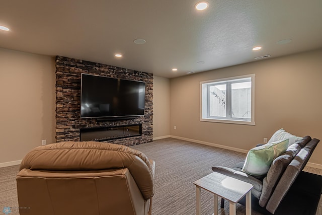 living room featuring carpet and a fireplace