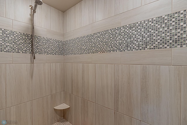 bathroom featuring tiled shower