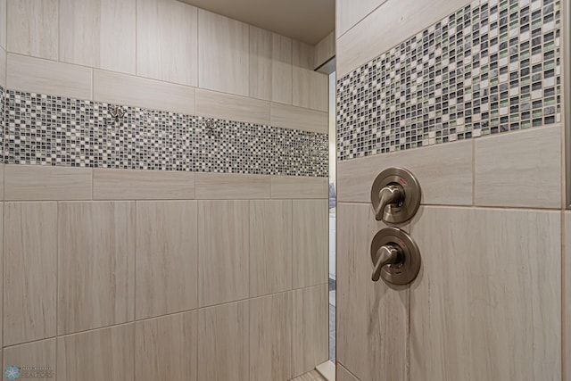 details with a tile shower