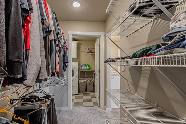 spacious closet with carpet and washer / clothes dryer