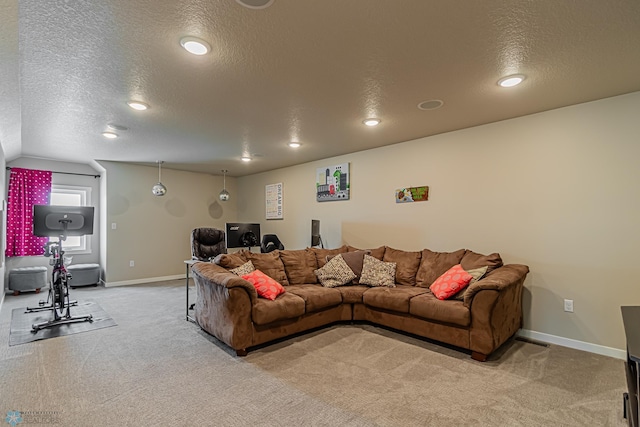 living room featuring a textured ceiling and light carpet