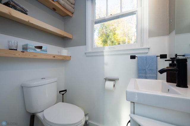 bathroom featuring sink and toilet