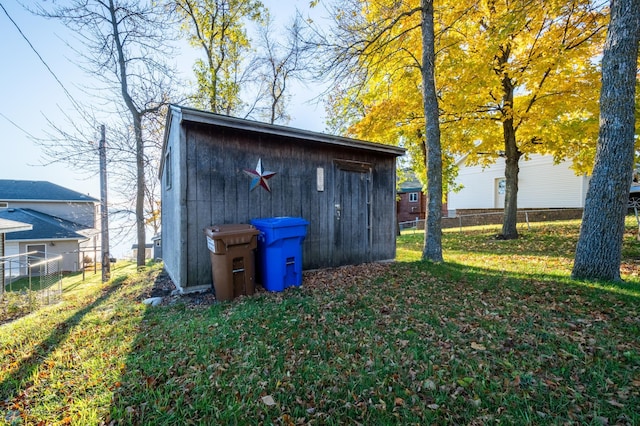 view of outdoor structure with a lawn