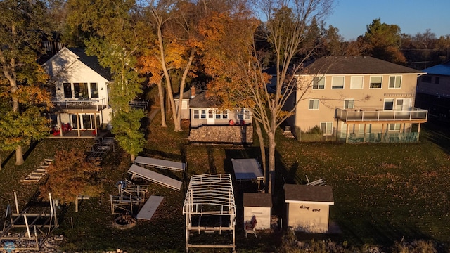 rear view of house featuring a lawn