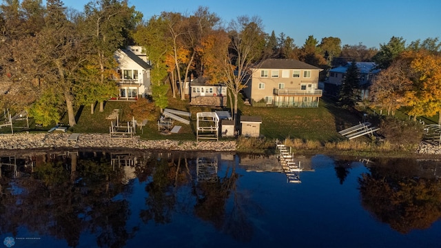 back of house featuring a water view