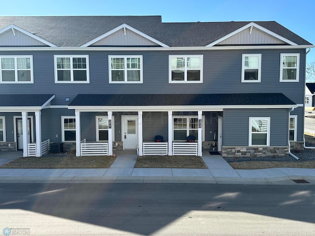 view of front of home featuring a porch and central AC