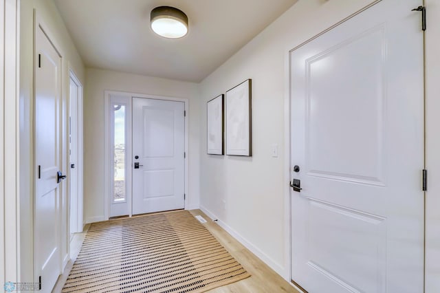 foyer with light wood-type flooring