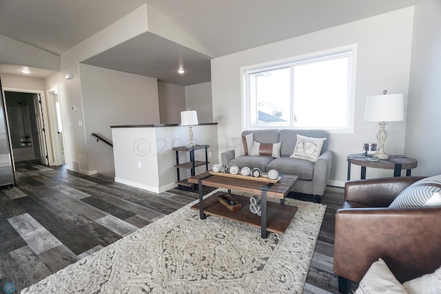 living room with vaulted ceiling and dark hardwood / wood-style flooring