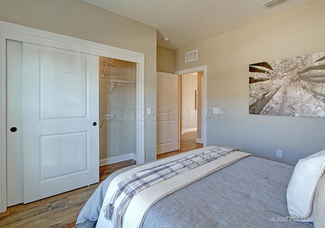 bedroom featuring a closet and hardwood / wood-style floors