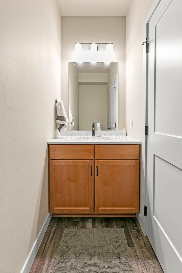 bathroom featuring wood-type flooring and vanity