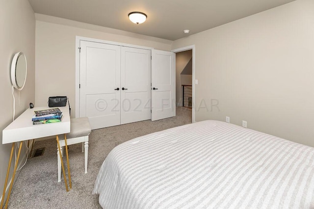 carpeted bedroom featuring a closet