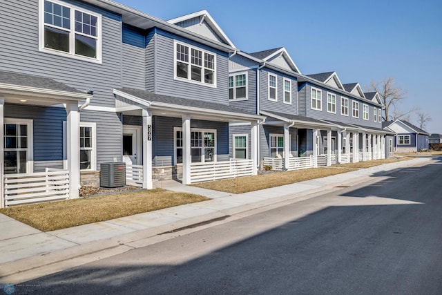 multi unit property with a porch and central AC