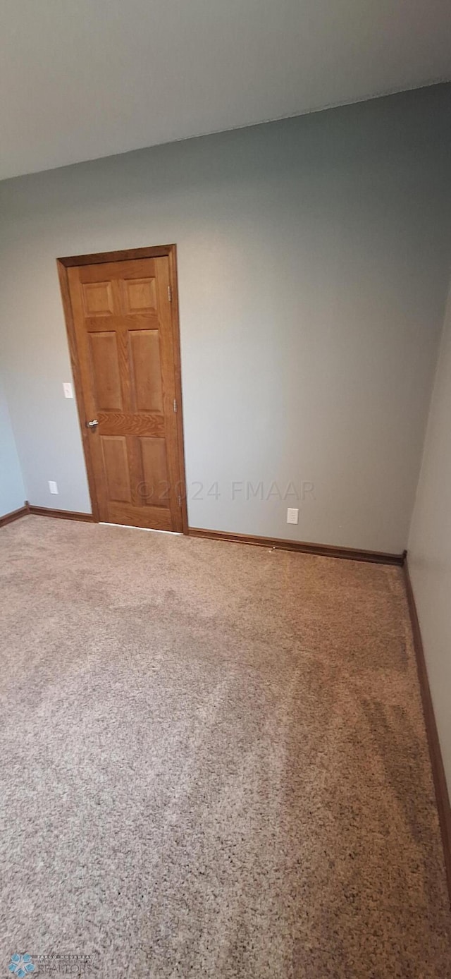 empty room featuring carpet flooring