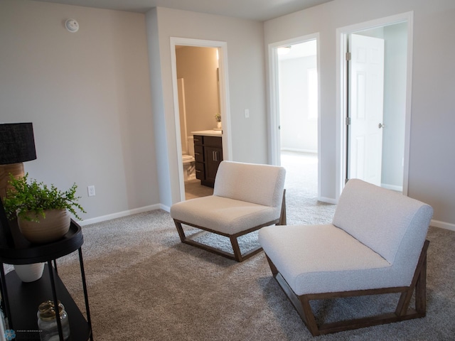 living area featuring light colored carpet