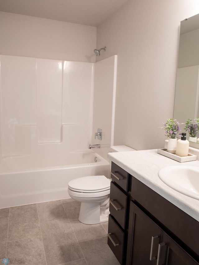 full bathroom featuring tile patterned flooring, vanity, toilet, and shower / bath combination