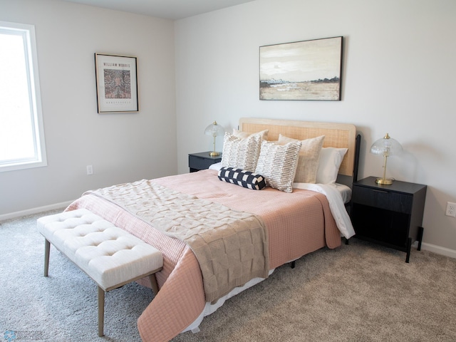 bedroom featuring light colored carpet