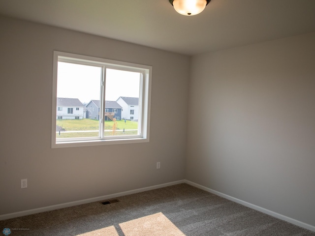 view of carpeted spare room