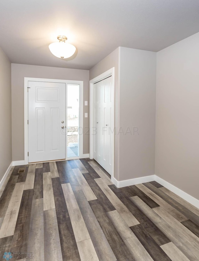 entrance foyer with hardwood / wood-style floors