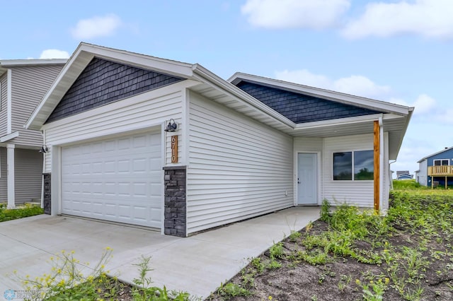 view of side of home with a garage