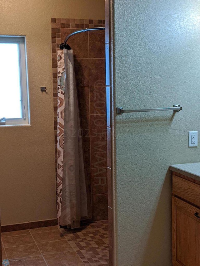 bathroom featuring vanity and tile floors