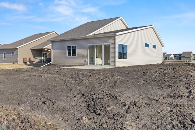 back of house with a patio area