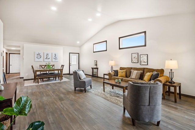 living room with hardwood / wood-style floors and lofted ceiling