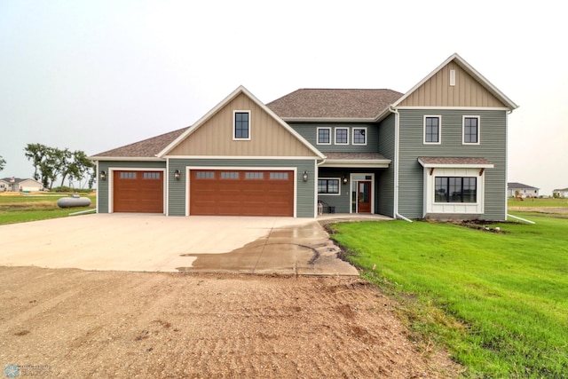 craftsman house with a garage and a front yard