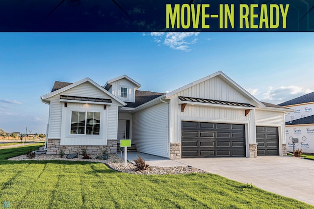 view of front of property with a front lawn and a garage