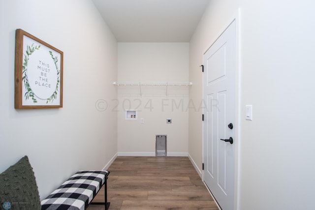 laundry room with hardwood / wood-style floors, hookup for an electric dryer, and hookup for a washing machine