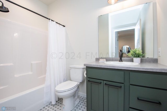 full bathroom with vanity with extensive cabinet space, toilet, tile floors, and shower / bath combo with shower curtain