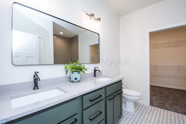 bathroom with toilet, double vanity, and tile flooring