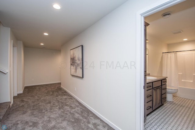 hallway with light carpet