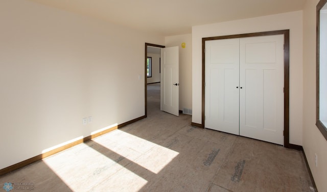 unfurnished bedroom with a closet