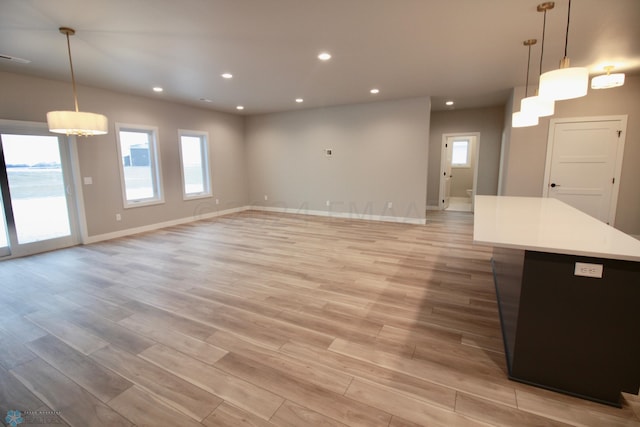 unfurnished living room featuring light wood-type flooring