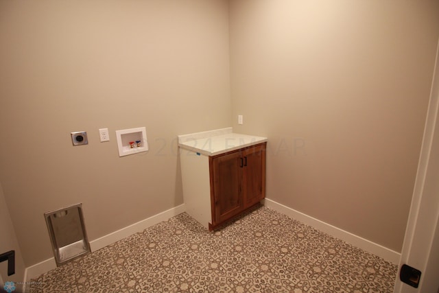 laundry room featuring hookup for an electric dryer, hookup for a washing machine, and light tile floors