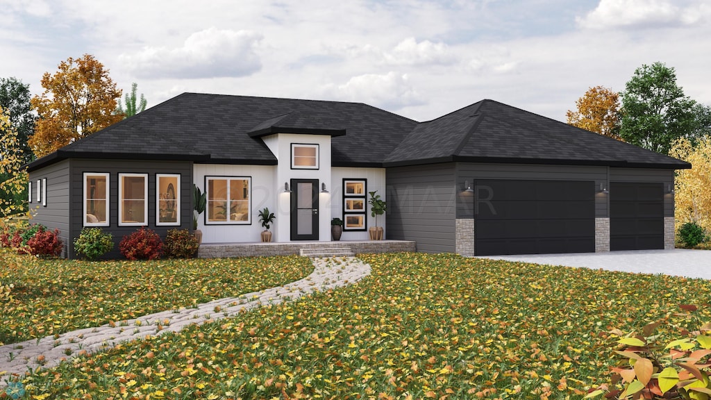 view of front facade featuring a garage and a front yard