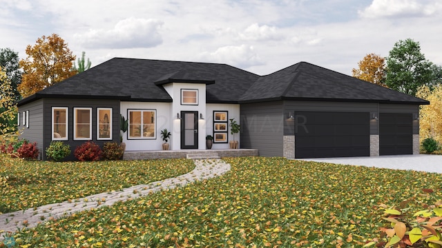 view of front facade featuring a garage and a front yard