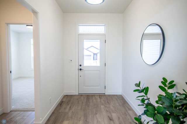 foyer with light wood-type flooring