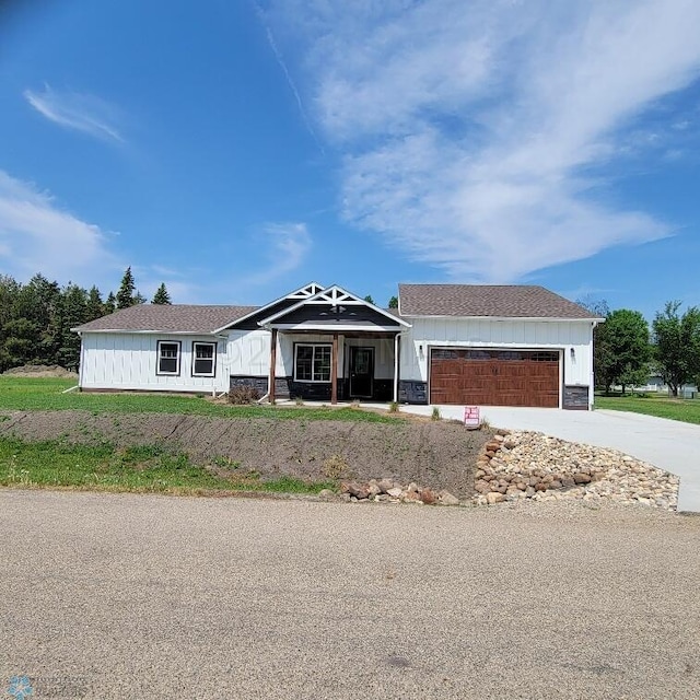 ranch-style home featuring a garage