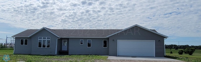 ranch-style house featuring a garage