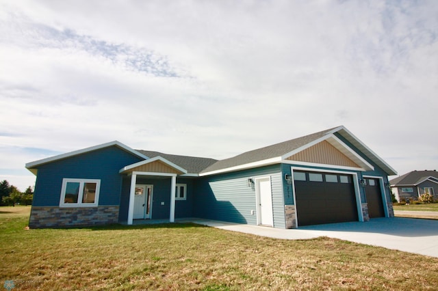 craftsman-style house with a front yard and a garage