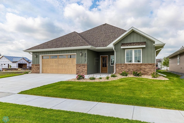 view of front of property featuring a garage and a front lawn