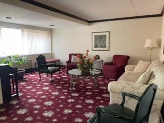 living room featuring ornamental molding