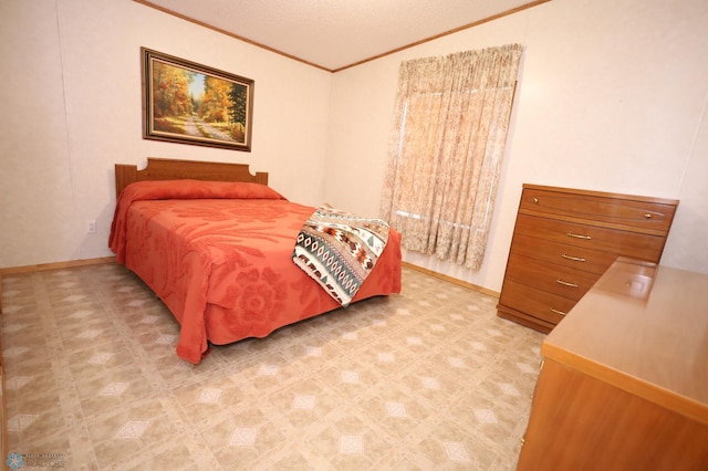 bedroom with ornamental molding and a textured ceiling