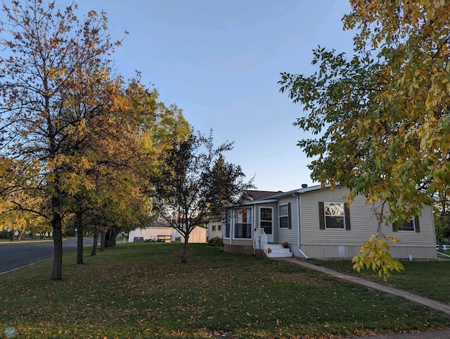 view of front of home with a front lawn