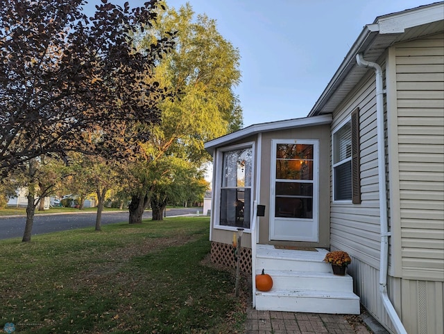 wooden deck featuring a yard