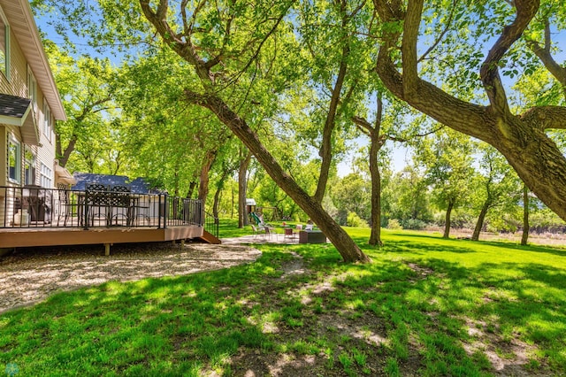 view of yard featuring a wooden deck