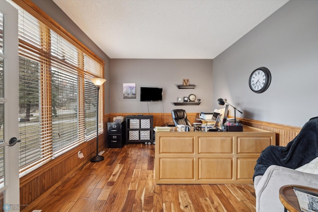 home office with hardwood / wood-style flooring