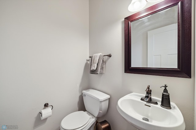 bathroom with sink and toilet